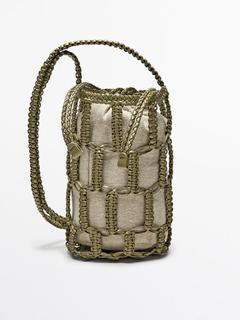 Pletená mini kabelka v tvare vaku z nappa kože v akcii za 129€ v Massimo Dutti
